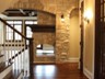 Hallway - White Birch Hardwood Floors & Stone Wall with Arched Detail