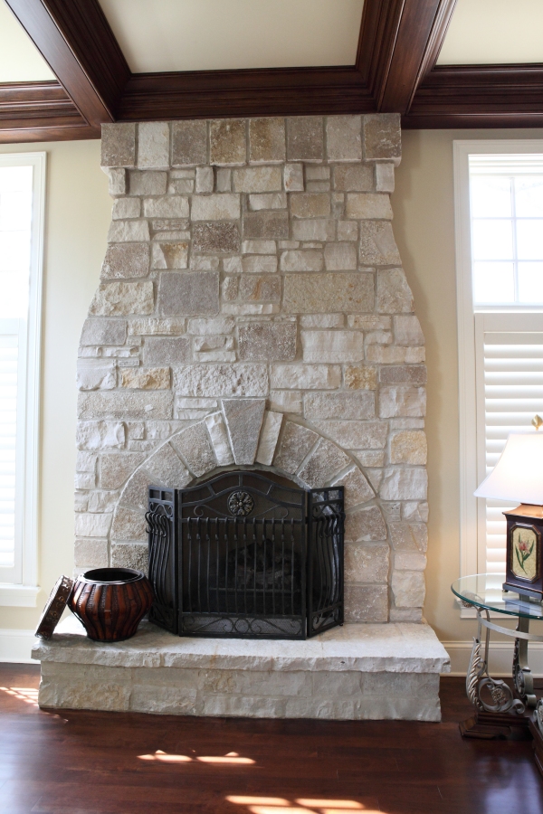 Stone Fireplace with Soldier Course and Keystone by Battaglia Homes - Hinsdale, IL