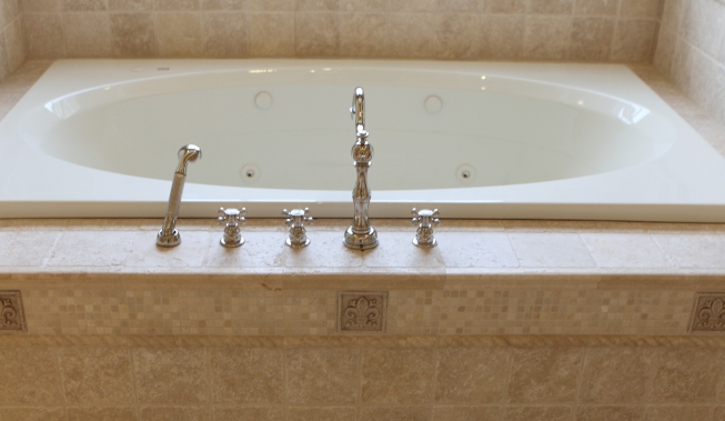Polished nickel tub faucet by Battaglia Homes, Hinsdale, IL